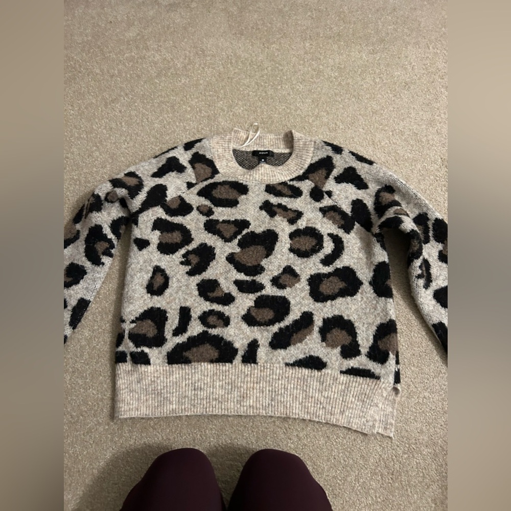 Aqua Bloomingdale’s size s. Good used condition. Minor piling as shown